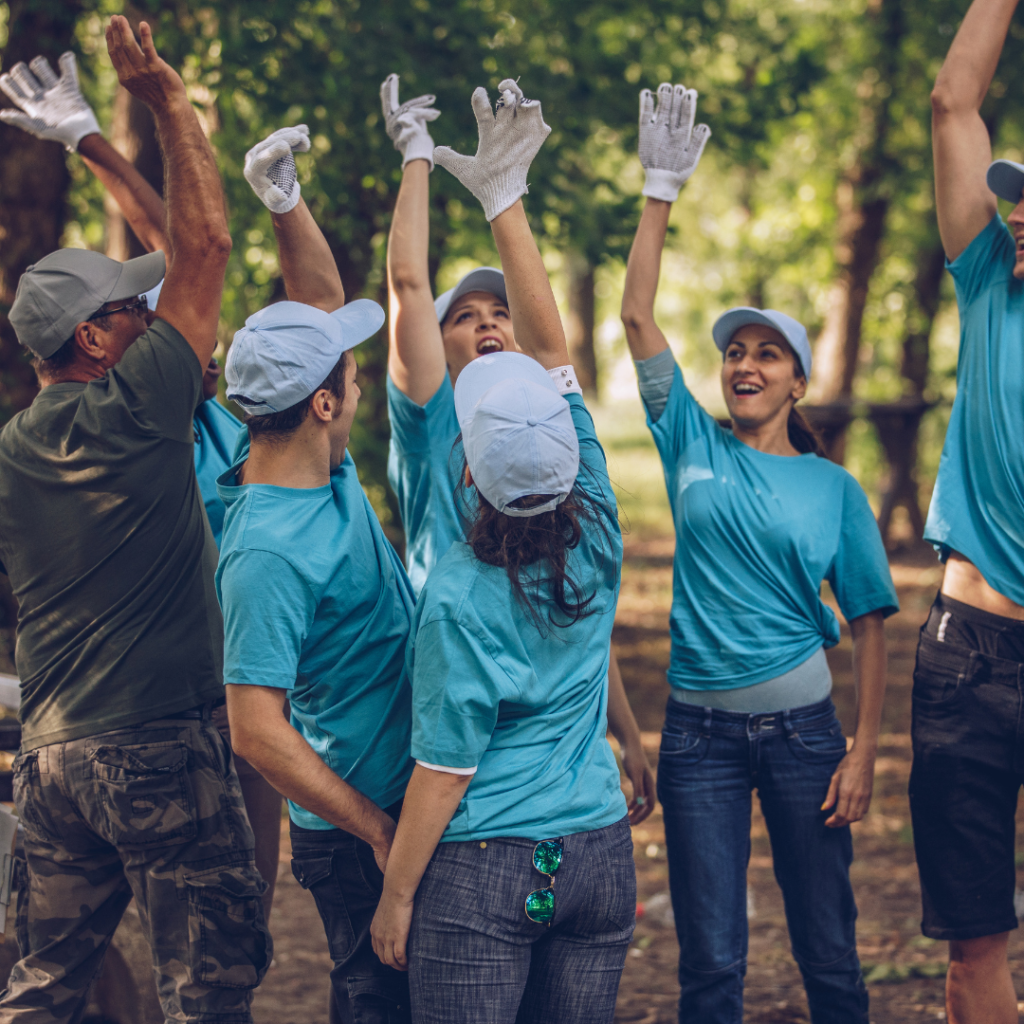 group of volunteers doing a group high five