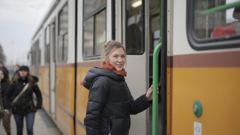 woman getting on a train