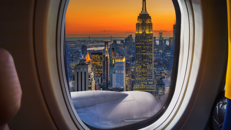 Looking out a plane window at a city
