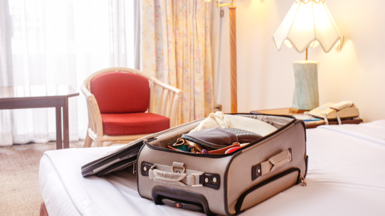 suitcase on hotel bed